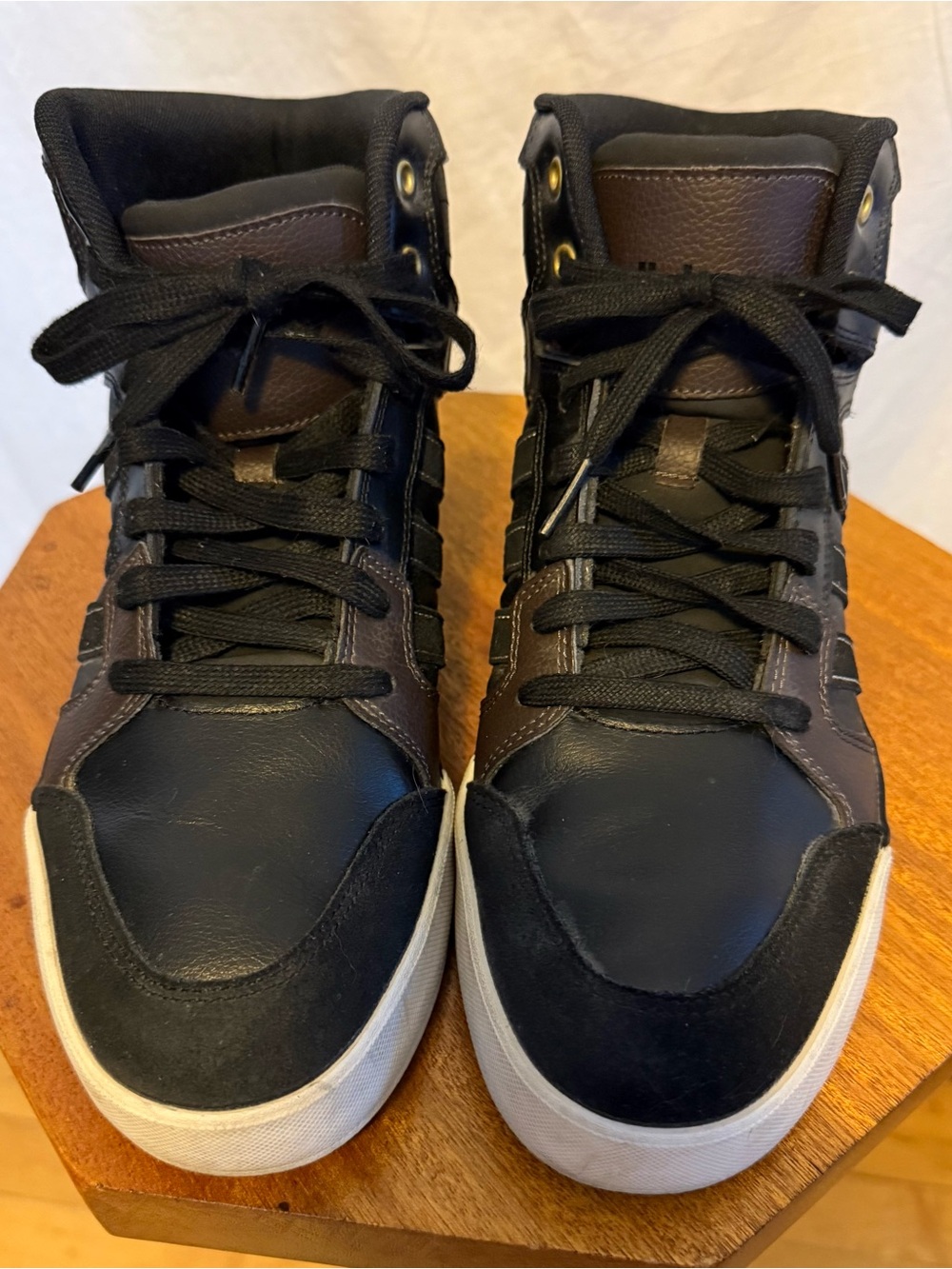 Adidas NEO Raleigh mid sneaker featuring a high top design with rubber soles.